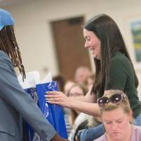 woman receiving gift at luncheon